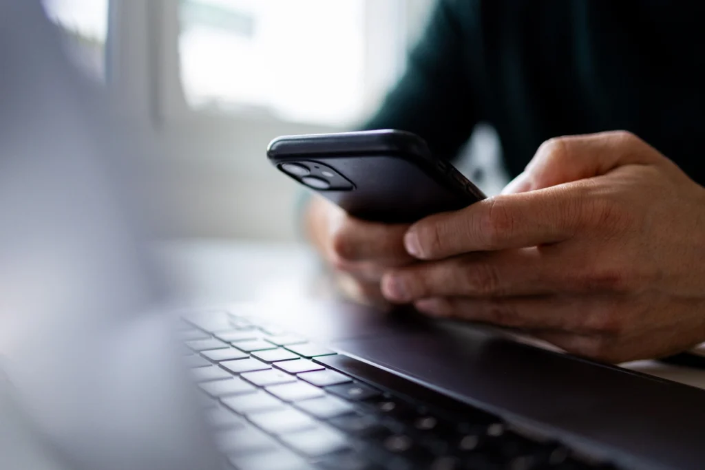 channels of customer communication: a man holding a phone